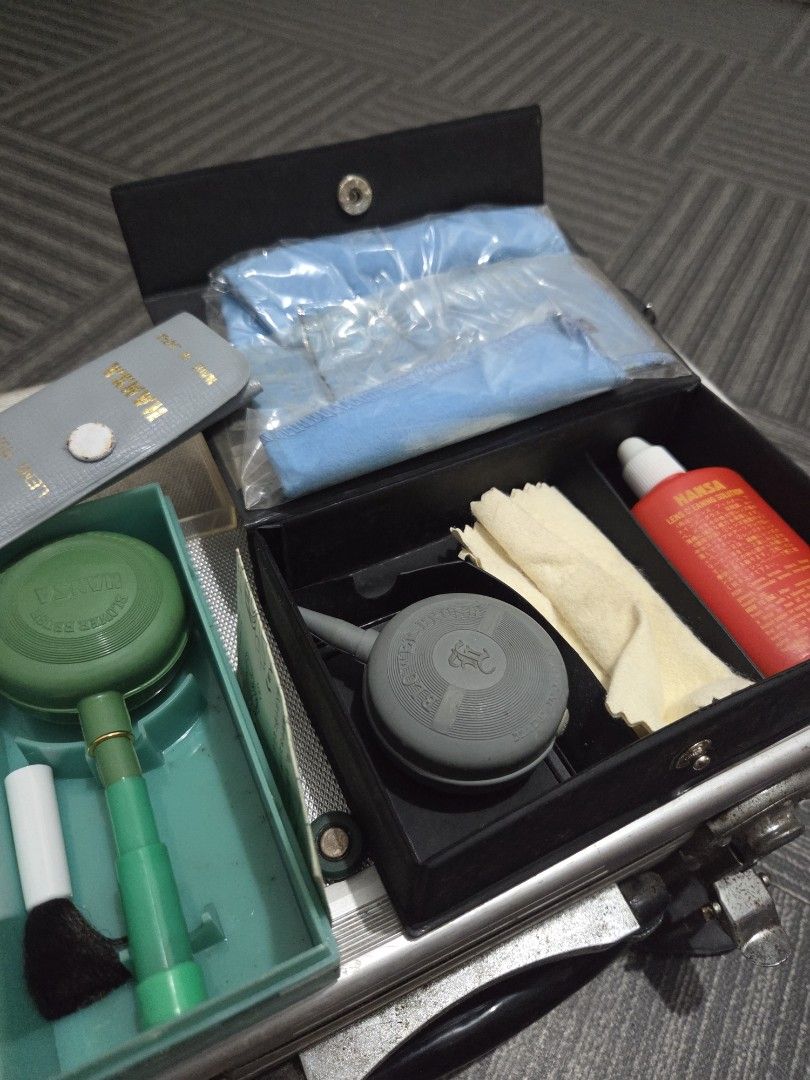 Hansa Camera Cleaning Set L with Solution and Brushes (Category: Cameras) located in Manila. Submitted by manilafilmshop (Listing ID 1465183459, Image 2). Description: - Complete Hansa vintage camera cleaning kit - Includes cleaning solution, lens cloths, air blowers, and brush tools - Comes in a stylish black storage case with gold lettering - Bonus: Extra green blower brush in its original clear plastic packaging - Ideal for maintaining vintage