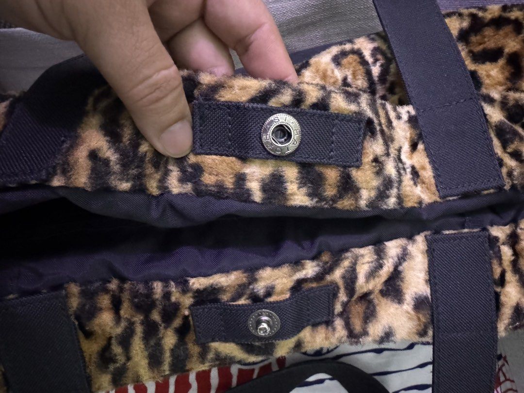 Head Porter Leopard Print Fur Canvas Tote Bag (Category: Tote Bags) located in Manila. Submitted by esparciake75752 (Listing ID 1465304431, Image 3). Description: - Authentic Head Porter tote bag - Upper half: Stylish leopard print faux fur - Lower half: Durable black canvas - Secure snap button tab closure - Dual black carrying handles - Interior dark fabric lining with zippered pocket - Features the classic woven Yoshida & Co Porter logo patch.