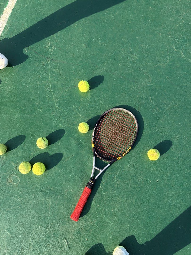 Head ti.fire Titanium Tennis Racket (Category: Racket and Ball Sports) located in Davao. Submitted by mherst28 (Listing ID 1465195858, Image 3). Description: - Model: Head Ti.Fire Tennis Racket - Build: Durable titanium construction in black and silver with yellow details - Ready to play: Comes with a standard string pattern - Comfort: Wrapped handle grip + choice of free yellow or red overgrip tape - Ideal for: Recreational matches, casual games
