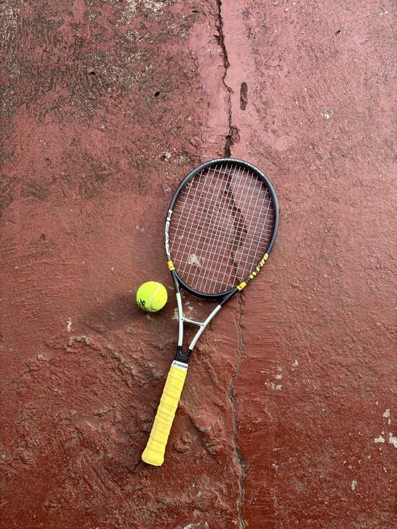 Head ti.fire Titanium Tennis Racket (Category: Racket and Ball Sports) located in Davao. Submitted by mherst28 (Listing ID 1465195858, Image 2). Description: - Model: Head Ti.Fire Tennis Racket - Build: Durable titanium construction in black and silver with yellow details - Ready to play: Comes with a standard string pattern - Comfort: Wrapped handle grip + choice of free yellow or red overgrip tape - Ideal for: Recreational matches, casual games