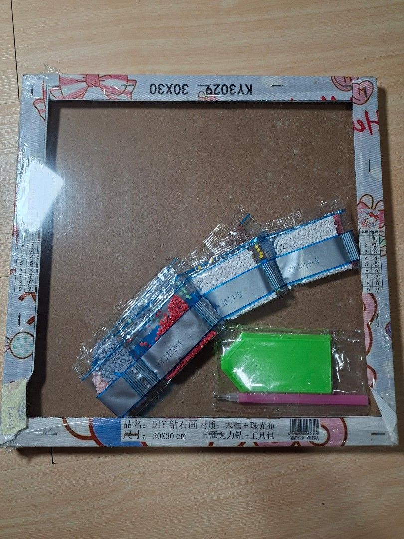 Hello Kitty DIY Diamond Painting Kit 30x30cm (Category: Art & Prints) located in Baguio. Submitted by restyrille77846 (Listing ID 1465173944, Image 3). Description: - Kitty themed diamond painting kit - Size: 30x30 cm - Complete set: includes framed canvas, labeled drills, green sorting tray, and applicator pen - Brand new and unopened with original shrink wrap - Great for relaxing craft nights or rainy days.