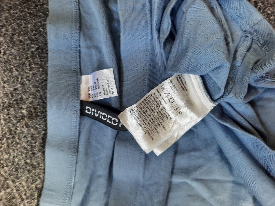 H&M Divided Blue Off-Shoulder Crop Top (Category: Sleeveless) located in San Jose del Monte. Submitted by leslymhey (Listing ID 1465215046, Image 3). Description: - Brand: Divided by H&M - Style: Light blue off-shoulder crop top with short sleeves - Fit: Snug fitted silhouette - Size: EUR XXS - Material: 95% cotton, 5% elastane - Condition/Details: Clean tag intact, made in India.