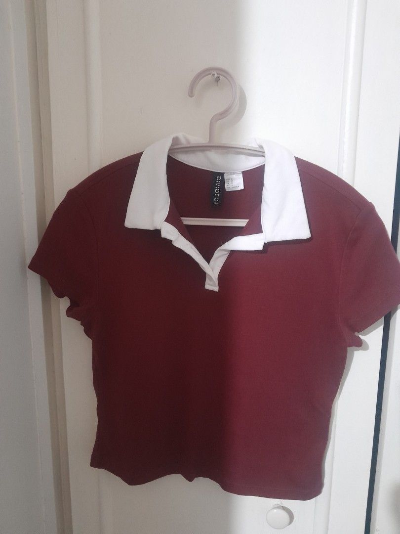 H&M Divided polo shirt tshirt blouse (Category: Shirts) located in Quezon City. Submitted by warmturtle.ba931b (Listing ID 1465302115, Image 2). Description: H&M Divided Polo Shirt 🏷️ Authentic H&M Divided shirt 🍷 Beautiful burgundy/wine-red color with contrasting white collar 📏 Size M on tag 👩 Ideal for ladies with small to medium body frame ✨ Like new to lightly used condition 🧺 Clean and washed 💕 Well kept and well maintained ✅ No rips, 