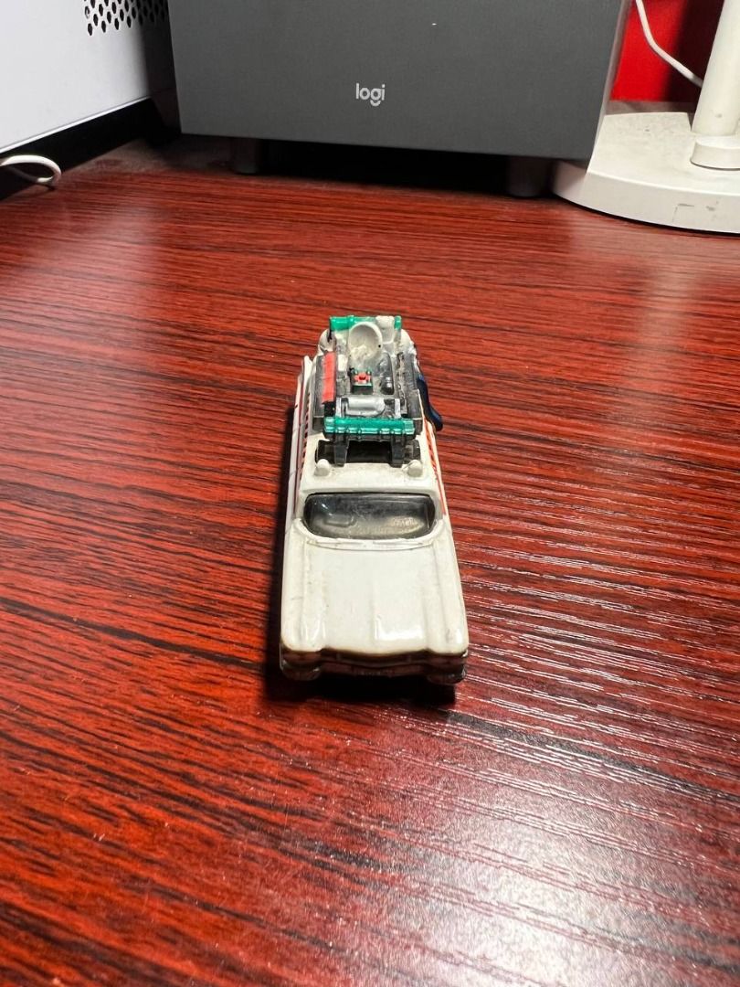 Hot Wheels Ghostbusters Ecto-1 Diecast Vehicle (Category: Vehicle & Diecast Models) located in Baguio. Submitted by ditoyzb08176 (Listing ID 1465314846, Image 2). Description: - Scale: Standard 1:64 diecast model - Design: White body with iconic red tailfins, detailed side striping, and rooftop equipment - Condition: Smooth-rolling wheels - Manufacturing: Mattel 2014, made in Malaysia - Perfect for Ghostbusters fans and diecast collectors Locatio