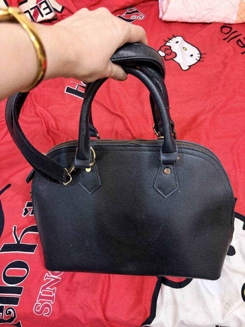 HOWRU Black Handbag with Long Strap (Category: Shoulder Bags) located in Manila. Submitted by welllovebyme (Listing ID 1465311461, Image 2). Description: Decluttering due to buying new bags. Barely used.