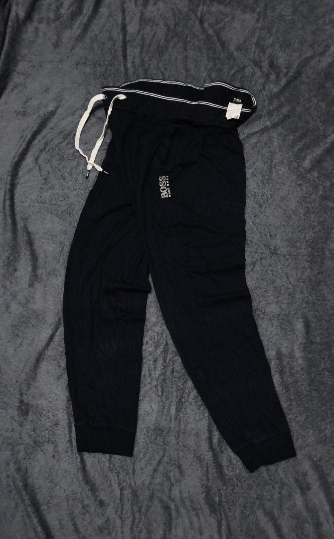 Hugo Boss Sweat Pants (Category: Luxury Apparel) located in Caloocan City. Submitted by cogeothriftapparel (Listing ID 1465298226, Image 1). Description: BOSS BY HUGO BOSS MENS LOUNGE SWEATPANTS Featuring an elastic waistband with a white drawstring and the signature BOSS logo on the upper left leg ‎Materials: Luxury Cotton ‎ ‎‎Size in inches: ‎ ‎Waist: 32 relax stretch to 34 ‎ ‎Lenght: 39 leg opening: 6 ‎ ‎Condition: Excellent ‎ ‎Price: 899 Free