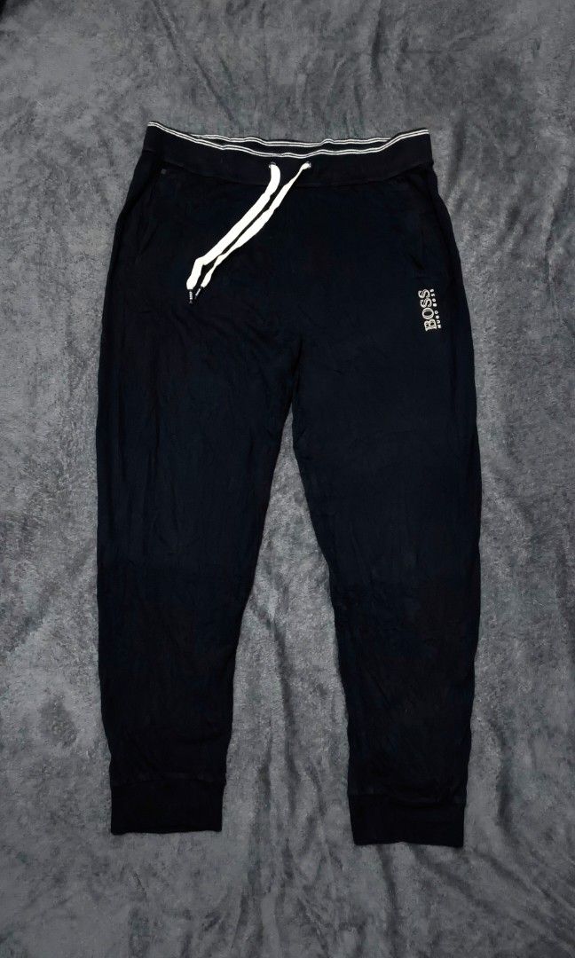 Hugo Boss Sweat Pants (Category: Luxury Apparel) located in Caloocan City. Submitted by cogeothriftapparel (Listing ID 1465298226, Image 2). Description: BOSS BY HUGO BOSS MENS LOUNGE SWEATPANTS Featuring an elastic waistband with a white drawstring and the signature BOSS logo on the upper left leg ‎Materials: Luxury Cotton ‎ ‎‎Size in inches: ‎ ‎Waist: 32 relax stretch to 34 ‎ ‎Lenght: 39 leg opening: 6 ‎ ‎Condition: Excellent ‎ ‎Price: 899 Free