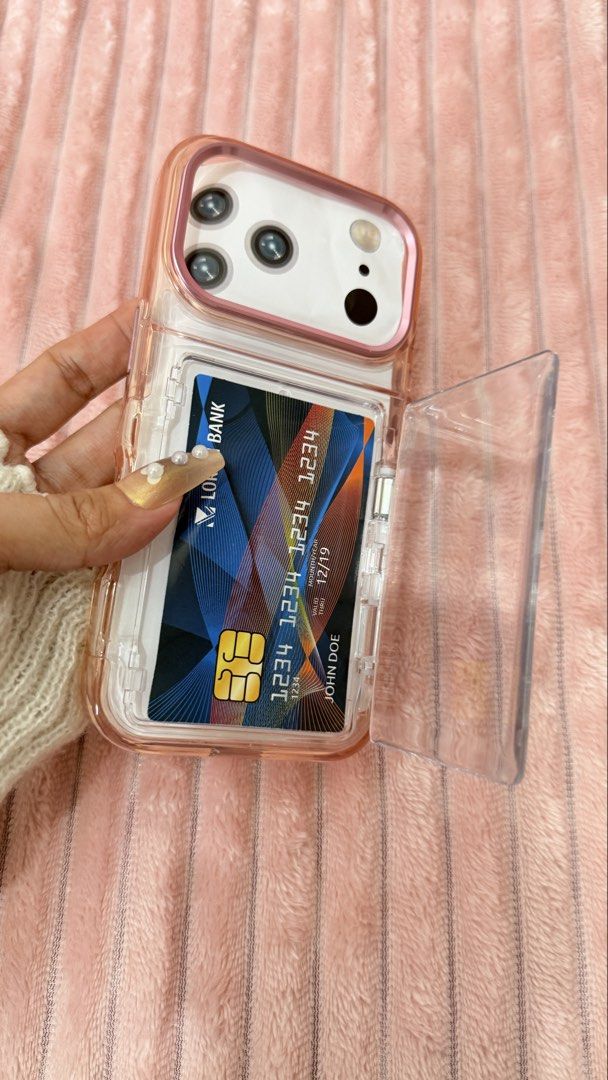 IPHONE 17 pro Case (Category: Cases & Sleeves) located in Cavite. Submitted by jam90053 (Listing ID 1465376474, Image 3). Description: - Designed specifically for iPhone 17 Pro - Features a secure, transparent swing-open card slot on the back for IDs or transit cards - Stylish pink and clear color combination - Durable protective construction against daily drops and scratches.