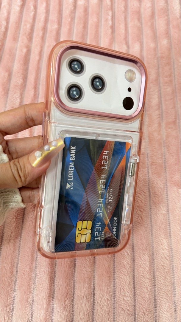 IPHONE 17 pro Case (Category: Cases & Sleeves) located in Cavite. Submitted by jam90053 (Listing ID 1465376474, Image 1). Description: - Designed specifically for iPhone 17 Pro - Features a secure, transparent swing-open card slot on the back for IDs or transit cards - Stylish pink and clear color combination - Durable protective construction against daily drops and scratches.