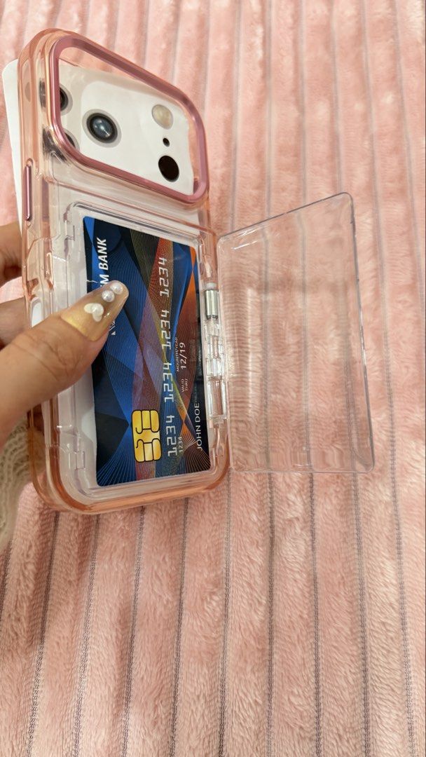 IPHONE 17 pro Case (Category: Cases & Sleeves) located in Cavite. Submitted by jam90053 (Listing ID 1465376474, Image 2). Description: - Designed specifically for iPhone 17 Pro - Features a secure, transparent swing-open card slot on the back for IDs or transit cards - Stylish pink and clear color combination - Durable protective construction against daily drops and scratches.