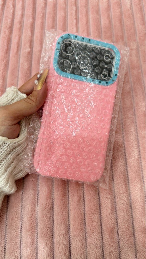 IPHONE 17pro Case (Category: Cases & Sleeves) located in Cavite. Submitted by jam90053 (Listing ID 1465376529, Image 3). Description: - Compatible with iPhone 17 Pro - Cute pink body with contrasting blue camera frame - Features stylish lettering detail along the bezel - Provides sturdy protection for your phone and camera area.