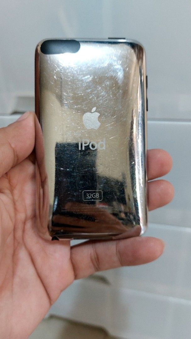 IPod touch 3rd Gen. 32Gb (Category: Portable Music Players) located in Quezon City. Submitted by christopher.torio18 (Listing ID 1465298098, Image 3). Description: - Model: Apple iPod Touch 3rd Generation - Storage Capacity: 32GB - Condition: Tested and working, normal signs of use with visible scratches on the iconic chrome back panel - Display & OS: Clear screen, fully functional touch and settings - Ideal for: Music listening, retro gaming, or