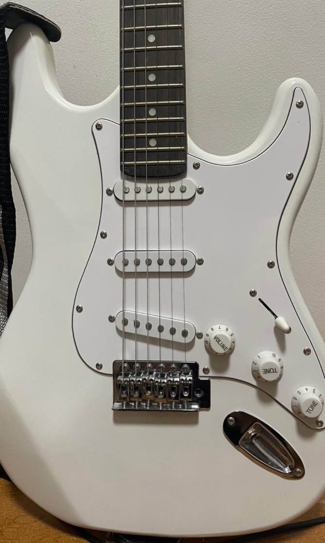 Irin White Electric Guitar with Accessories Bundle (Category: Musical Instruments) located in Manila. Submitted by kingsophi3 (Listing ID 1465233070, Image 2). Description: -Included: Guitar, strap, IRIN clip-on tuner, brand new pack of strings, whammy bar, adjustment wrenches, and picks.