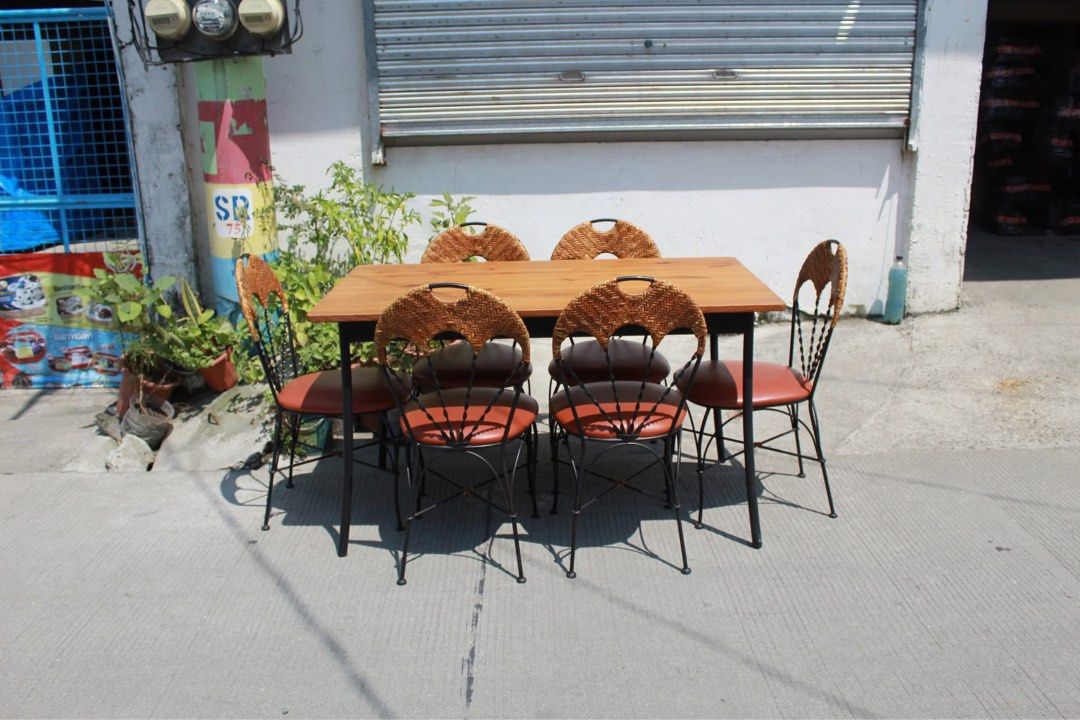 Japan 6-Seater Dining Set 🇯🇵 (Category: Tables & Sets) located in San Fernando. Submitted by juls.japan.surplus (Listing ID 1465335462, Image 1). Description: 6-Seater Dining Set Vintage-inspired 6-seater dining set with six chairs with woven rattan backrests, padded leather seats and black metal frames. Warm wood-grain dining table with a sturdy black metal base. Perfect for dining areas and classic interiors Table size L:51 ¼ • W:29 ¾ • H:29 