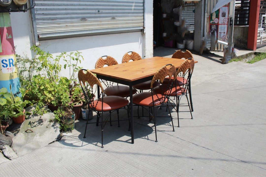 Japan 6-Seater Dining Set 🇯🇵 (Category: Tables & Sets) located in San Fernando. Submitted by juls.japan.surplus (Listing ID 1465335462, Image 2). Description: 6-Seater Dining Set Vintage-inspired 6-seater dining set with six chairs with woven rattan backrests, padded leather seats and black metal frames. Warm wood-grain dining table with a sturdy black metal base. Perfect for dining areas and classic interiors Table size L:51 ¼ • W:29 ¾ • H:29 