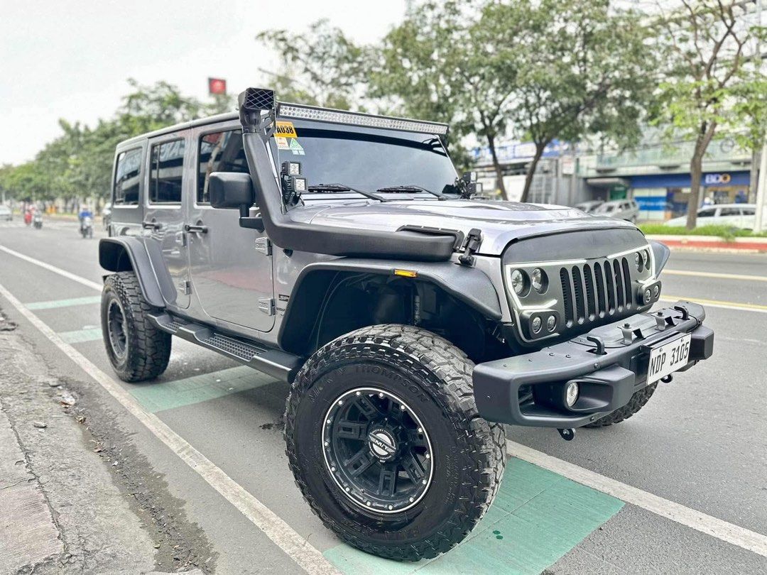 Jeep Wrangler 4x4 Auto (Category: Used Cars) located in Manila. Submitted by quality_cars (Listing ID 1465355618, Image 2). Description: 2019 Jeep Wrangler 4x4 Price: ₱2.195m ✅ FINANCING IN HOUSE & BANK ✅ TRADE IN ‼️ 5tkm LOWEST MILEAGE IN THE MARKET ‼️ FULLY LOADED - BRAND NEW CONDITION ‼️ CAR SHOW QUALITY 2019 June Acquired 5tkm+ LOW ORIGINAL MILEAGE - dare to scan Automatic Transmission 3.6L V6 Gas Engine Mickey Thompson Set of Mags and Tires 