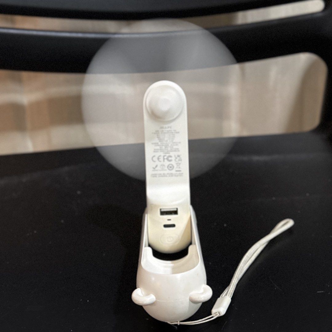 JISULIFE handheld mini fan with power bank function (Category: Fans) located in Makati City. Submitted by julyco. (Listing ID 1465362094, Image 1). Description: - Brand New JISULIFE Portable Mini Fan (White) - Compact and foldable design, perfect for travel and daily commutes - Doubles as a power bank with USB and Type-C charging ports - Built-in lanyard for convenient and easy carrying - Rechargeable battery with adjustable multiple speed settin