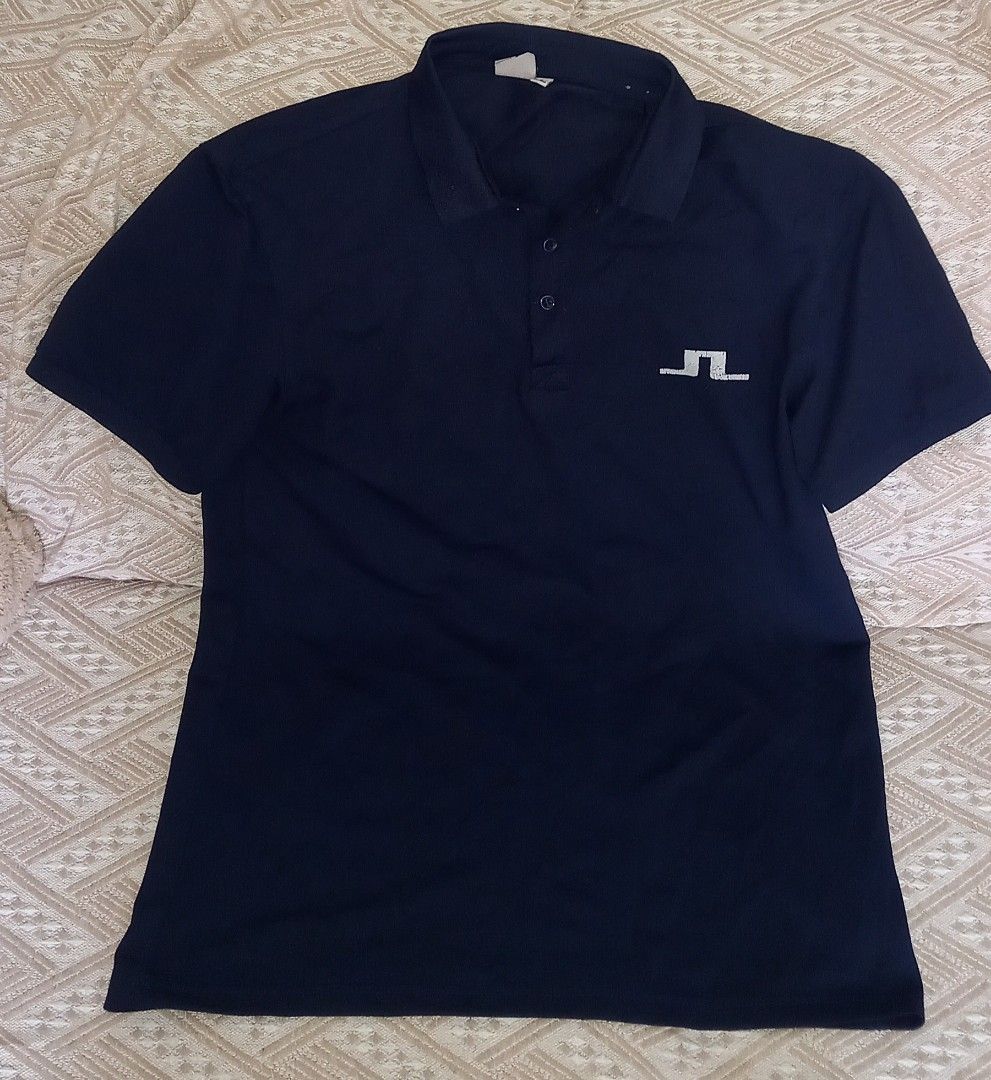 j.lindeberg Dark Blue Polo Shirt (Category: Tshirts & Polo Shirts ) located in Cagayan de Oro. Submitted by edwardryan01984 (Listing ID 1465291334, Image 1). Description: - Brand: J.Lindeberg - Size Large - Color: Dark blue / Navy - Fit: Standard fit - Details: Classic collar, 3-button placket, short sleeves - Branding: Distinct white bridge logo printed on the left chest - Material: Soft and comfortable fabric.