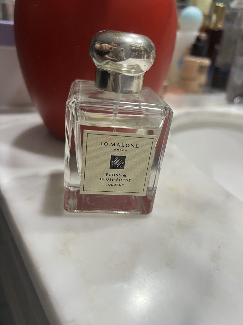 Jo Malone Peony & Blush Suede Cologne 50ml (75-80% full) — AUTHENTIC (Category: Fragrance & Deodorants) located in Manila. Submitted by ourcotings (Listing ID 1465291165, Image 2). Description: Jo Malone London Peony & Blush Suede Cologne * Authentic Jo Malone London Peony & Blush Suede Cologne * Size: 1.7 fl. oz. / 50ml * Approximately 75–80% full * Clear glass bottle with silver cap and classic beige label * Batch code and local distributor sti