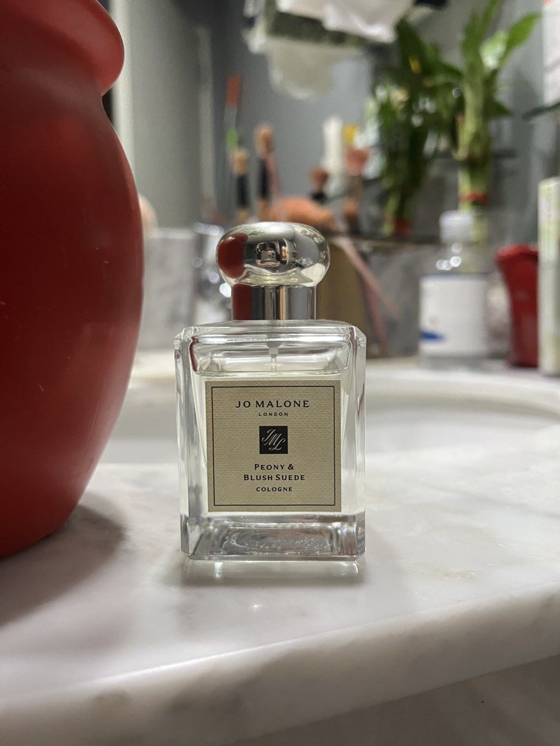 Jo Malone Peony & Blush Suede Cologne 50ml (75-80% full) — AUTHENTIC (Category: Fragrance & Deodorants) located in Manila. Submitted by ourcotings (Listing ID 1465291165, Image 1). Description: Jo Malone London Peony & Blush Suede Cologne * Authentic Jo Malone London Peony & Blush Suede Cologne * Size: 1.7 fl. oz. / 50ml * Approximately 75–80% full * Clear glass bottle with silver cap and classic beige label * Batch code and local distributor sti