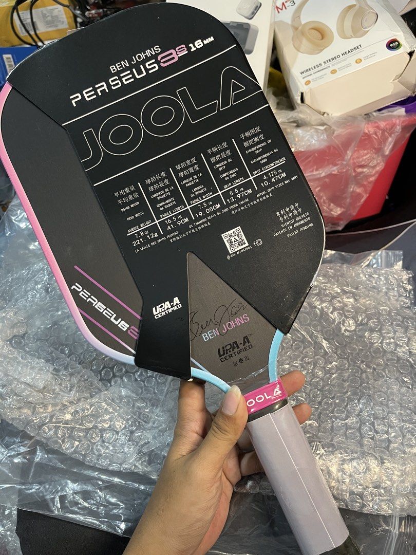 JOOLA Ben Johns Perseus 3S 16mm Pickleball Paddle (Category: Racket and Ball Sports) located in Manila. Submitted by abbigail029. (Listing ID 1465201314, Image 1). Description: - Model: JOOLA Ben Johns Perseus 3S - Thickness: 16mm - Condition: Brand new in original packaging, with plastic wrap and handle warranty tag attached - Certification: Official UPA-A certified - Design: Signature edition by Ben Johns.