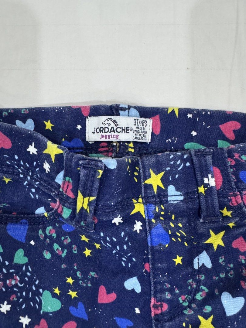 Jordache Printed Jegging Size 3T (Category: Babies & Kids Fashion) located in Manila. Submitted by crazycat13 (Listing ID 1465171071, Image 2). Description: - Brand: Jordache - Size: 3T - Color: Dark blue denim with colorful hearts and yellow stars print - Waist: Comfortable elastic waistband with belt loops - Style: Pull-on jeggings - Perfect for everyday cute and comfy outfits!.