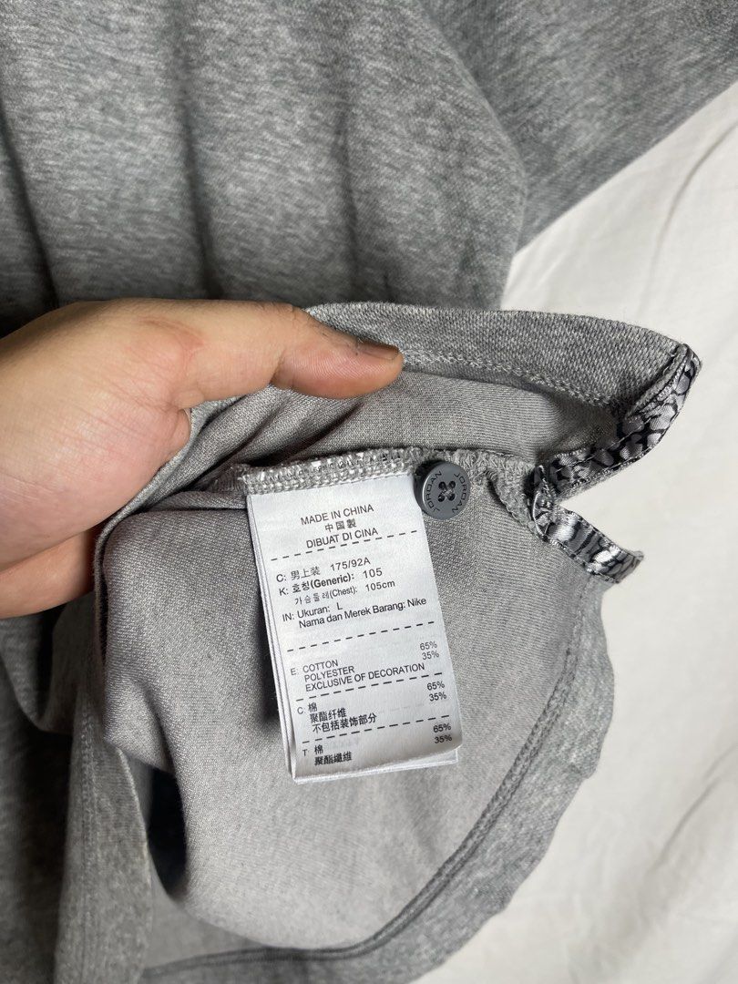 Jordan Grey Polo Shirt Size L (Category: Tshirts & Polo Shirts ) located in Manila. Submitted by noahcastilljos363 (Listing ID 1465380237, Image 3). Description: - Brand: Jordan - Color: Grey - Size: L - Material: 65% Cotton, 35% Polyester (Made in China) - Design: Classic collar with 2 buttons and short sleeves - Details: Black embroidered Jumpman logo on left chest, unique elephant print lining inside the collar, and side hem slits - Condition: