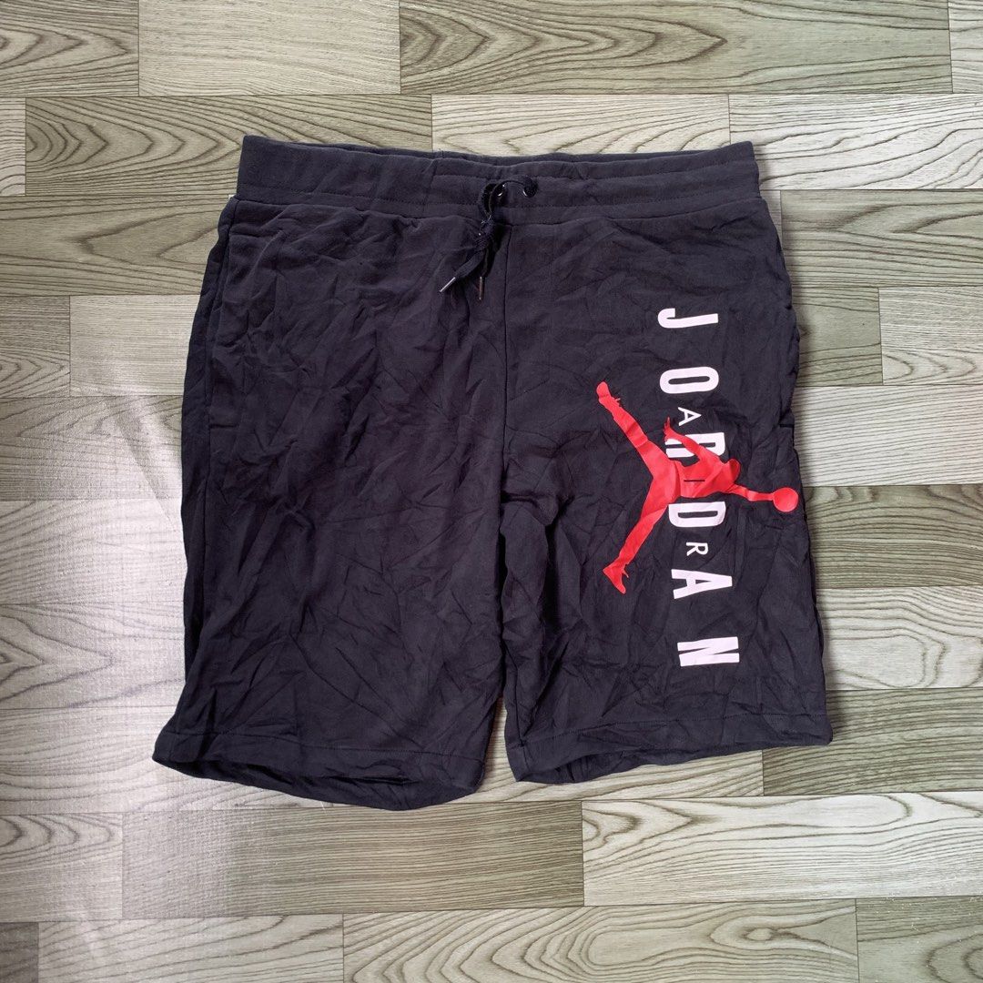 Jordan Jumpman Black Sweatshorts (Category: Shorts) located in Manila. Submitted by gentleflower-74686a (Listing ID 1465234222, Image 1). Description: - Brand: Jordan - Waistline; 35 / Length; 22.5 - Color: Black with red and pink Jumpman logo - Features: Elastic waist, drawstring with mini Jumpman prints - Condition: Light wear, fabric wrinkling, inner tags are heavily worn/frayed - Perfect for casual wear and daily comfort.