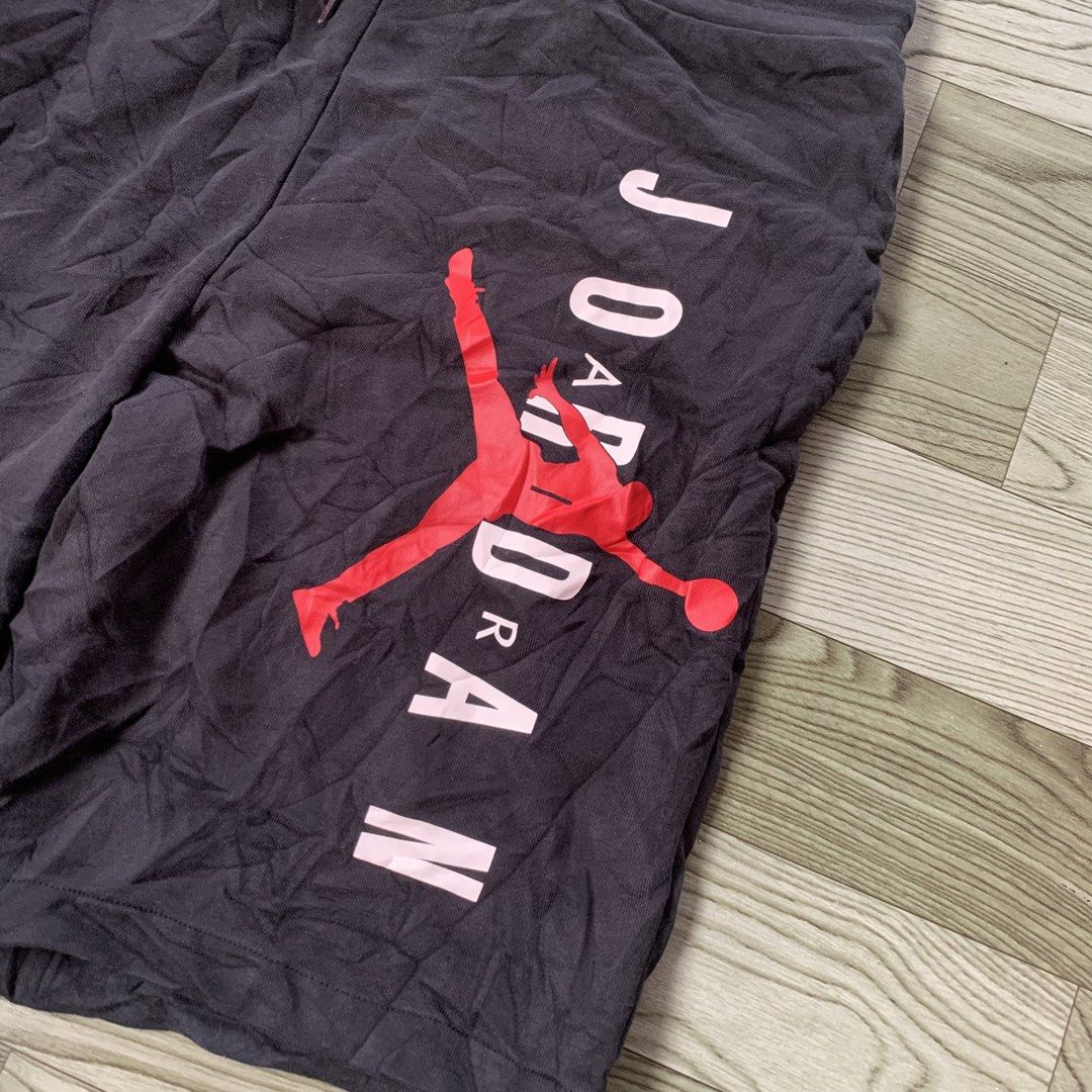 Jordan Jumpman Black Sweatshorts (Category: Shorts) located in Manila. Submitted by gentleflower-74686a (Listing ID 1465234222, Image 2). Description: - Brand: Jordan - Waistline; 35 / Length; 22.5 - Color: Black with red and pink Jumpman logo - Features: Elastic waist, drawstring with mini Jumpman prints - Condition: Light wear, fabric wrinkling, inner tags are heavily worn/frayed - Perfect for casual wear and daily comfort.