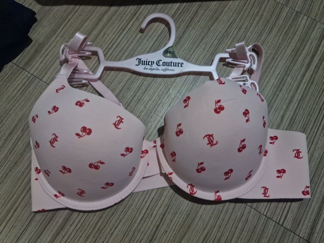 Juicy Couture Pink Cherry Print Bra 36C (Category: Undergarments & Loungewear) located in Quezon City. Submitted by pointyshoesandbags (Listing ID 1465294321, Image 1). Description: - Brand: Juicy Couture - Size: 36C - Color/Design: Light pink with all-over red cherries and monogram print - Features: Smooth molded cups and adjustable straps - Inclusion: Comes with the original branded pink hanger - Condition: Excellent, ready to wear.