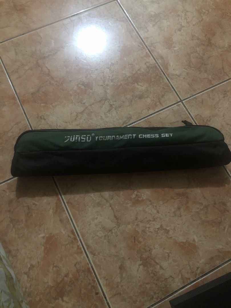 Junsu Tournament Chess Set (Category: Board Games & Puzzles) located in Manila. Submitted by warmstone_3189cf (Listing ID 1465313949, Image 1). Description: Junsu tournament chess set packed in a carrying case. Green and black roll-up design. Keeps pieces organized and easy to bring anywhere. Great for chess players on the go..