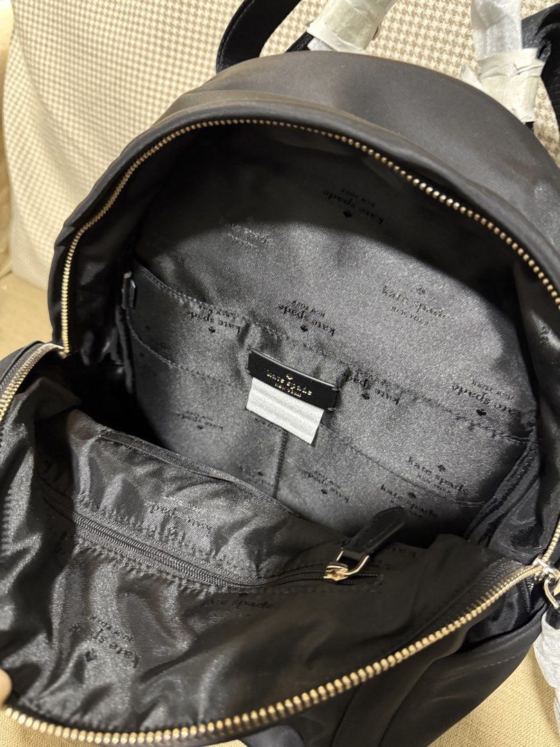 Kate Spade Chelsea Medium Backpack Black (Category: Backpacks) located in Quezon City. Submitted by gel.cortez (Listing ID 1465217446, Image 3). Description: - Brand: Kate Spade - Model: Chelsea Medium Backpack - Color: Classic Black - Material: Durable nylon with signature lining - Features: Secure zipper closure, handy front pocket, and multiple interior pockets for organization - Comfort: Adjustable shoulder straps and top handle - Condition: 
