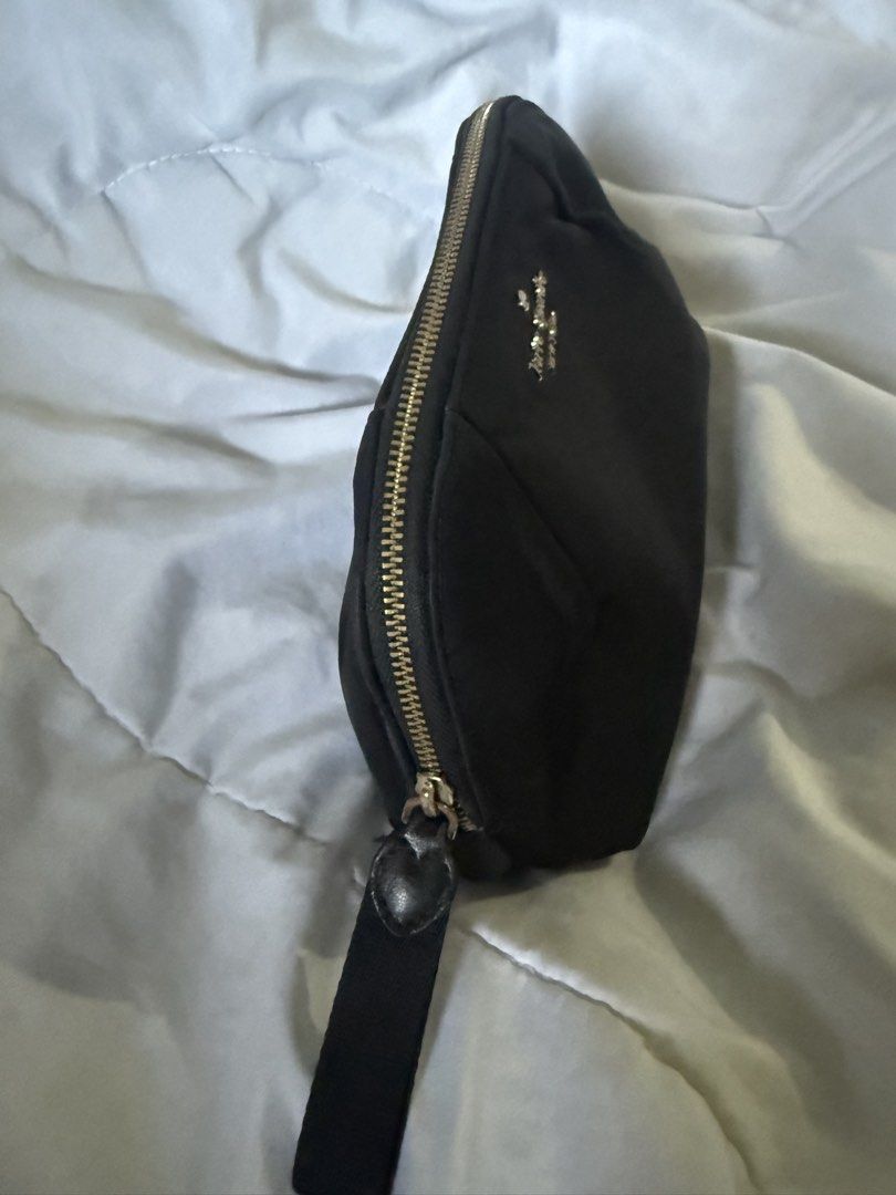 Kate Spade Pouch (Category: Purses & Pouches) located in Batangas. Submitted by gaprelovedthings (Listing ID 1465276816, Image 3). Description: - Authentic - Brand: Kate Spade New York - Material: Durable black nylon with gold-toned hardware - Design: Elegant pleated detailing on front and back, secure zipper closure with fabric pull tab - Interior: Clean lining with ample space for makeup and daily essentials - Condition: Well-maintained with mi