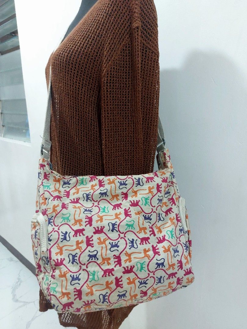 Kipling Garan Large Crossbody Bag (Category: Luxury Bags & Wallets) located in Muntinlupa City. Submitted by sakurambo_des (Listing ID 1465188854, Image 2). Description: Kipling Garan Large Crossbody Bag Multicolor Monkey mania with furry Allie Monkey charm Issue-preloved-need lng ng wash since nkastock lng and check last picture for flaws.