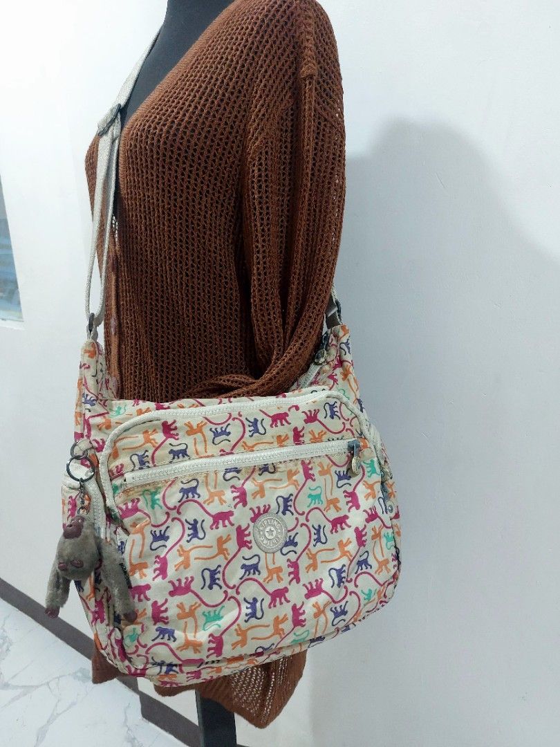 Kipling Garan Large Crossbody Bag (Category: Luxury Bags & Wallets) located in Muntinlupa City. Submitted by sakurambo_des (Listing ID 1465188854, Image 1). Description: Kipling Garan Large Crossbody Bag Multicolor Monkey mania with furry Allie Monkey charm Issue-preloved-need lng ng wash since nkastock lng and check last picture for flaws.