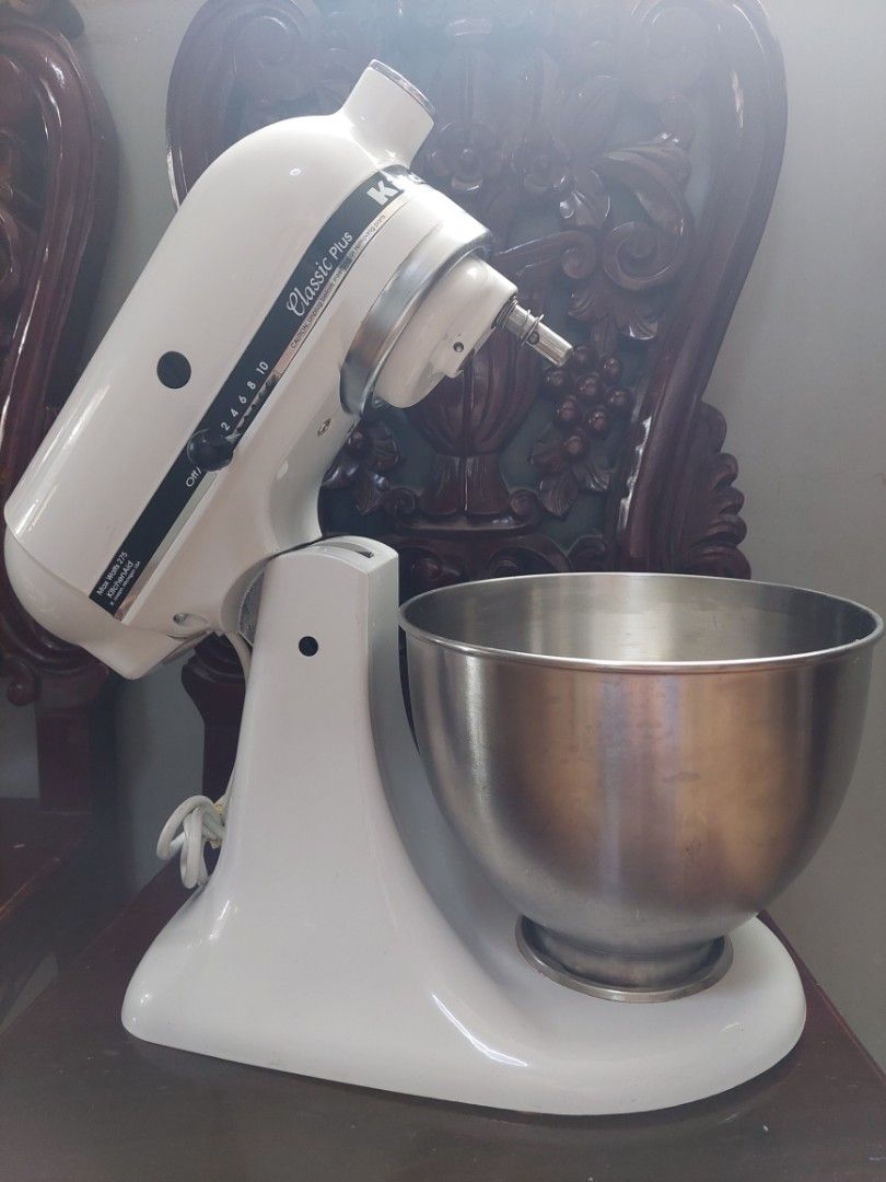 KitchenAid Classic Plus Stand Mixer White (Category: Hand & Stand Mixers) located in Pasig City. Submitted by brightocean_bb44a1 (Listing ID 1465265918, Image 2). Description: - Model: KitchenAid Classic Plus Stand Mixer - Color: White with stainless steel mixing bowl - Power: Standard 275W motor for all baking projects - Included Attachments: Flat beater and dough hook - Features: Cord wraps neatly around the base - Condition: Works great, shows