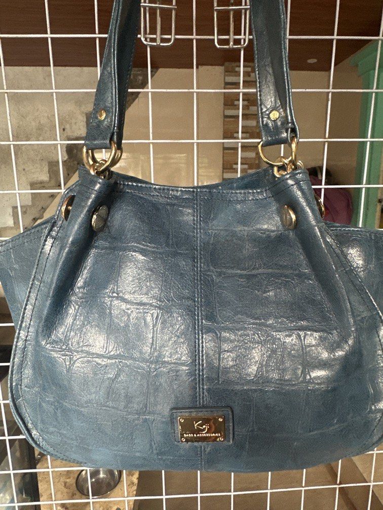 Koji (Category: Shoulder Bags) located in Caloocan City. Submitted by hariel_beverly_onlineshop (Listing ID 1465251528, Image 3). Description: This appears to be a blue-green, crocodile-embossed shoulder bag featuring gold-tone hardware and a small rectangular logo badge marked “Koji” on the front..