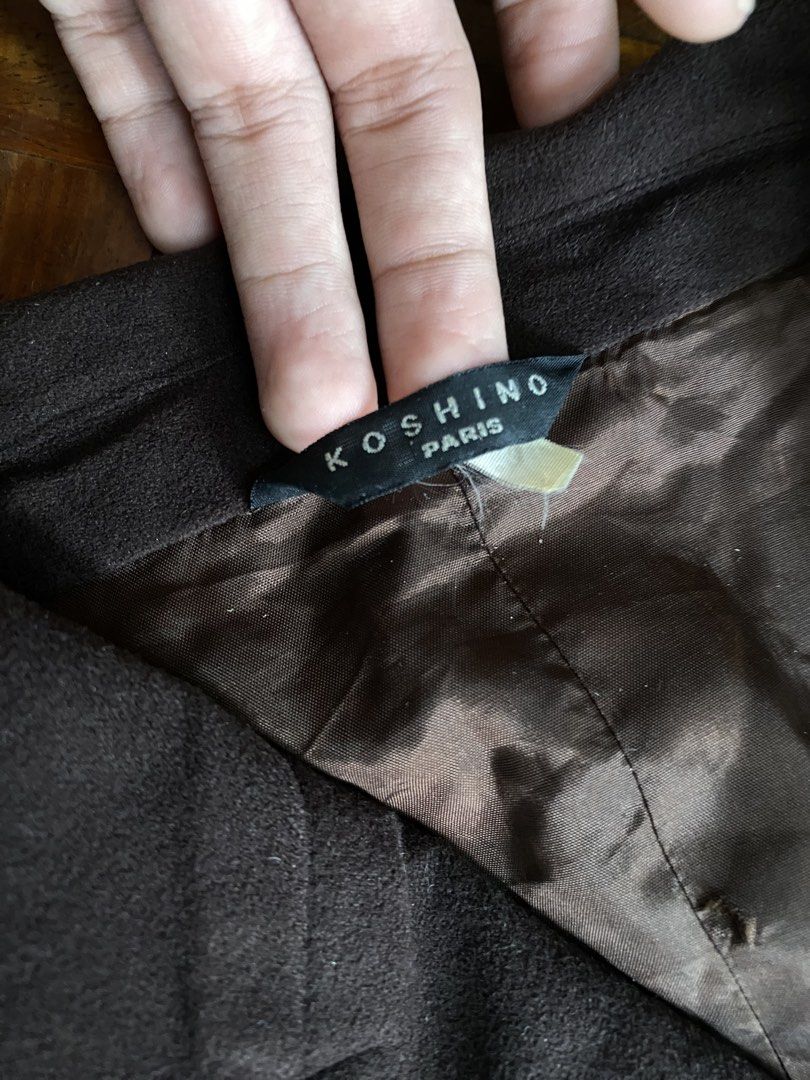 Koshino Paris Brown Button Blazer Jacket (Category: Coats, Jackets and Outerwear) located in Taguig. Submitted by cherylmnl.vintage (Listing ID 1465220415, Image 2). Description: - Brand: Koshino Paris - Color: Dark brown with matching satin lining - Closure: Classic four-button front - Collar: Classic lapel style - Pockets: Multiple functional buttoned front pockets - Fit: Structured and flattering - Interior: Fully lined with premium brown sati