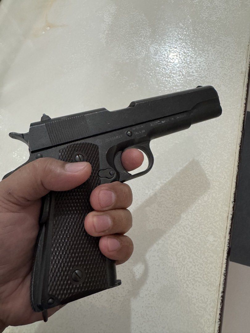 KWC M1911A1 6mm Airsoft Pistol (Category: Combat Sports) located in Cavite. Submitted by marcuz1316 (Listing ID 1465201178, Image 2). Description: - Model: KWC M1911A1 Gas Blowback Airsoft Pistol (6mm) - Authentic Details: Classic Colt slide markings with patent dates up to 1913 - Serial Number: Frame #30658867 - Condition: Fully functional with normal cosmetic scuffs and wear on the black finish from use - Inclusions: Comes with a detachable mag