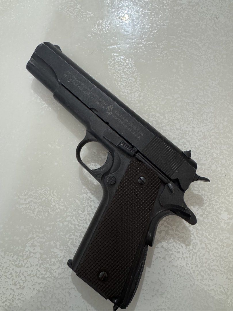 KWC M1911A1 6mm Airsoft Pistol (Category: Combat Sports) located in Cavite. Submitted by marcuz1316 (Listing ID 1465201178, Image 1). Description: - Model: KWC M1911A1 Gas Blowback Airsoft Pistol (6mm) - Authentic Details: Classic Colt slide markings with patent dates up to 1913 - Serial Number: Frame #30658867 - Condition: Fully functional with normal cosmetic scuffs and wear on the black finish from use - Inclusions: Comes with a detachable mag