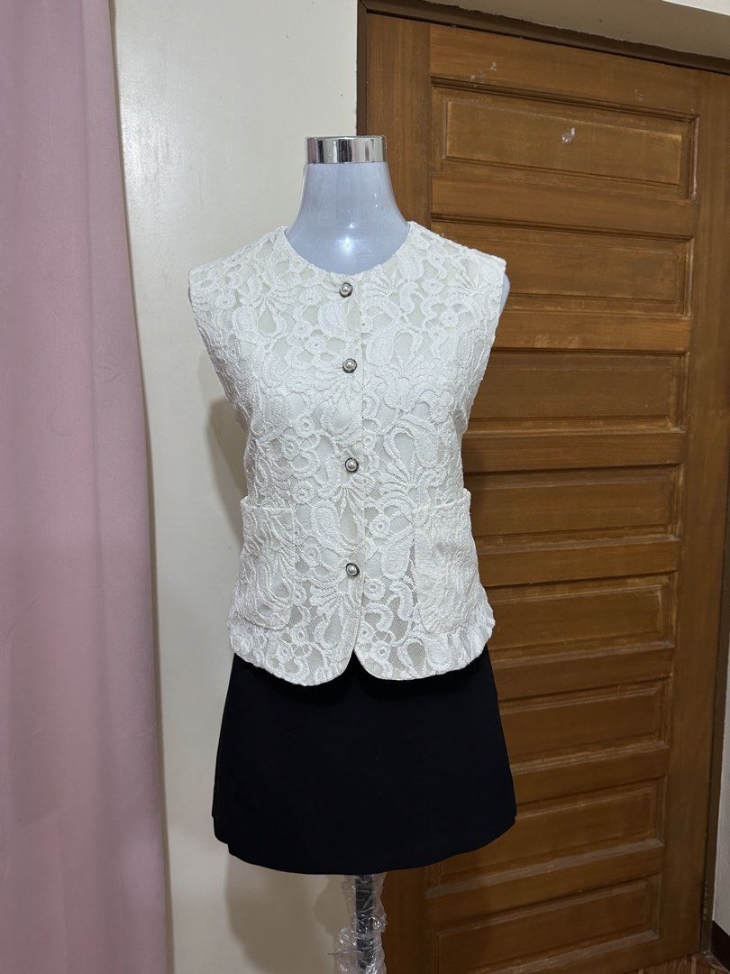 Lace vest (Category: Sleeveless) located in Manila. Submitted by vesti-da (Listing ID 1465230833, Image 1). Description: Fits M to L - Design: All-over floral lace pattern with round neckline - Details: Silver-rimmed pearl buttons and two functional front pockets - Lining: Fully lined interior - Fit: Clean finish along hems and armholes, perfect for layering over shirts or dresses.