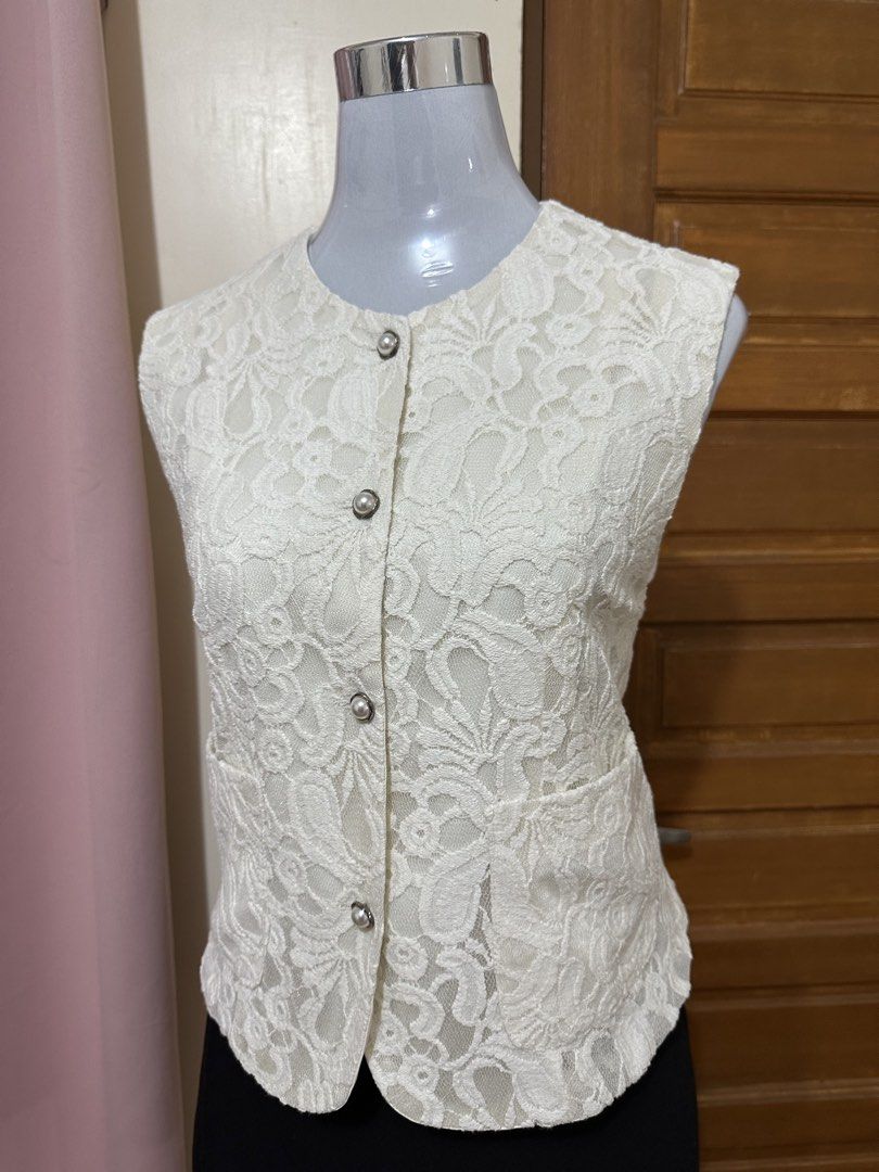 Lace vest (Category: Sleeveless) located in Manila. Submitted by vesti-da (Listing ID 1465230833, Image 2). Description: Fits M to L - Design: All-over floral lace pattern with round neckline - Details: Silver-rimmed pearl buttons and two functional front pockets - Lining: Fully lined interior - Fit: Clean finish along hems and armholes, perfect for layering over shirts or dresses.