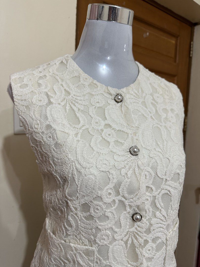 Lace vest (Category: Sleeveless) located in Manila. Submitted by vesti-da (Listing ID 1465230833, Image 3). Description: Fits M to L - Design: All-over floral lace pattern with round neckline - Details: Silver-rimmed pearl buttons and two functional front pockets - Lining: Fully lined interior - Fit: Clean finish along hems and armholes, perfect for layering over shirts or dresses.
