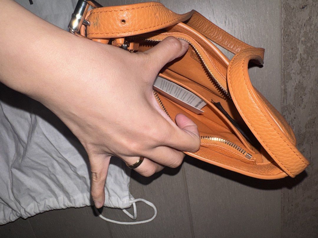 lacoste leather shoulder bag (orange) (Category: Shoulder Bags) located in Makati City. Submitted by jekjekdecls (Listing ID 1465190358, Image 3). Description: lacoste metal plate grained leather shoulder bag originally bought a few years back at around 6-8k in lacoste. lacoste doesnt sell this style anymore i dont think. rfs: havent used this bag in years. pls see pics for minor stains which can be removed but i suggest to handle with care in re