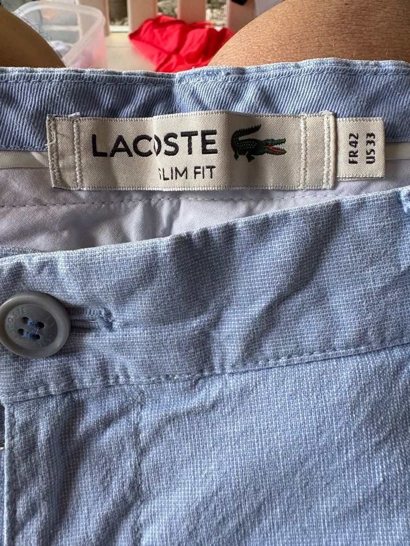 Lacoste light blue casual shorts size 42 (Category: Shorts) located in Danao, Cebu. Submitted by kentoy25 (Listing ID 1465241928, Image 3). Description: - Brand: Lacoste - Color: Light Blue - Size: 42 (tag on back pocket) - Material: Cotton and polyurethane blend - Pockets: Two front pockets, two back welt pockets with button closure - Details: Small embroidered alligator logo on the right back pocket - Style: Casual, ideal for warm weather.