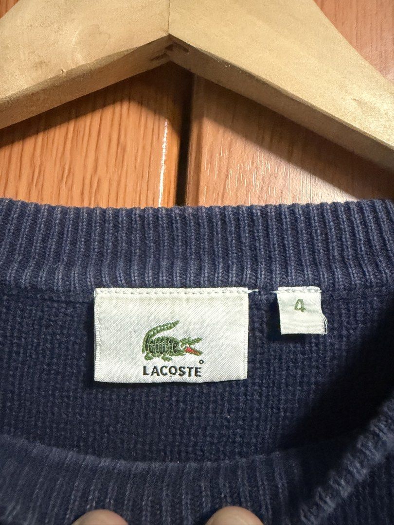 Lacoste Navy Blue Striped Knit Sweater Size 4 (Category: Longsleeves) located in Caloocan City. Submitted by puremountain.2e6573 (Listing ID 1465344308, Image 3). Description: Navy blue Lacoste knit sweater with thick white and bright blue chest stripes. Classic embroidered green crocodile logo on the left chest. Ribbed crew neck and vertical knit texture throughout. Size 4 tag at the collar. Clean interior tag stitching..