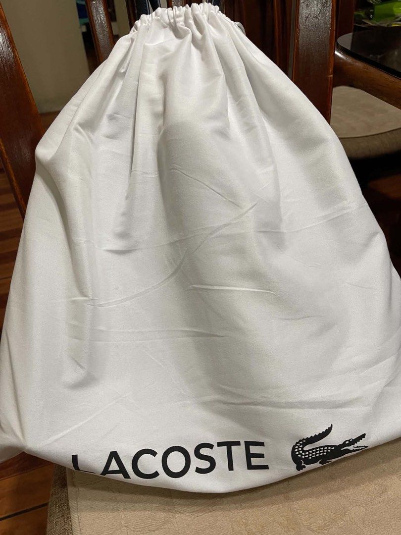 Lacoste Reversible Tote bag (Category: Tote Bags) located in Caloocan City. Submitted by enadearroz06865 (Listing ID 1465238536, Image 3). Description: Navy Blue / White Original Lacoste with dust bag Good as brand new Used 1 month only.