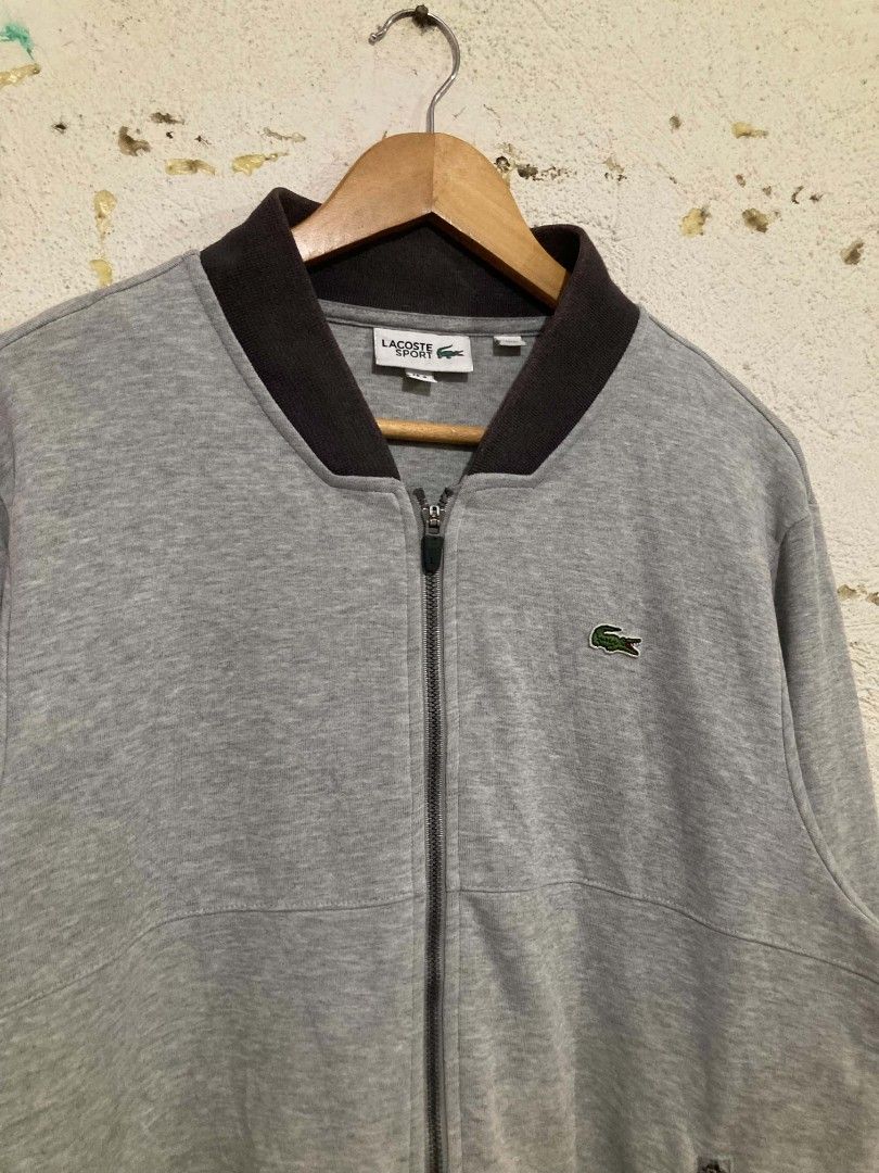 Lacoste Sport Grey Zip-Up Jacket (Category: Coats, Jackets and Outerwear) located in San Jose del Monte. Submitted by zen31 (Listing ID 1465278327, Image 2). Description: LACOSTE SPORT ZIP-UP JACKET FR 4 US M ON TAG 22X27 DIMENSION VERY GOOD CONDITION 9.5/10 COLOR RATE ISSUE: SOME FADE ON NECK PART .