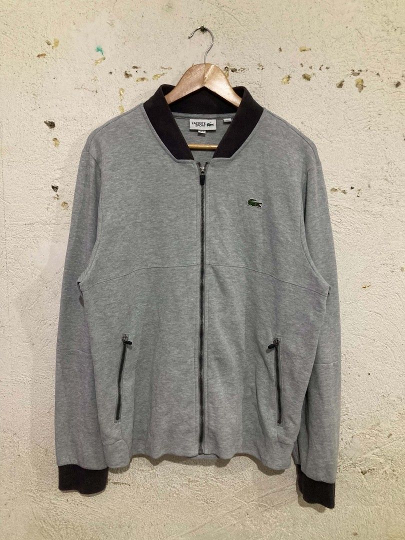 Lacoste Sport Grey Zip-Up Jacket (Category: Coats, Jackets and Outerwear) located in San Jose del Monte. Submitted by zen31 (Listing ID 1465278327, Image 1). Description: LACOSTE SPORT ZIP-UP JACKET FR 4 US M ON TAG 22X27 DIMENSION VERY GOOD CONDITION 9.5/10 COLOR RATE ISSUE: SOME FADE ON NECK PART .