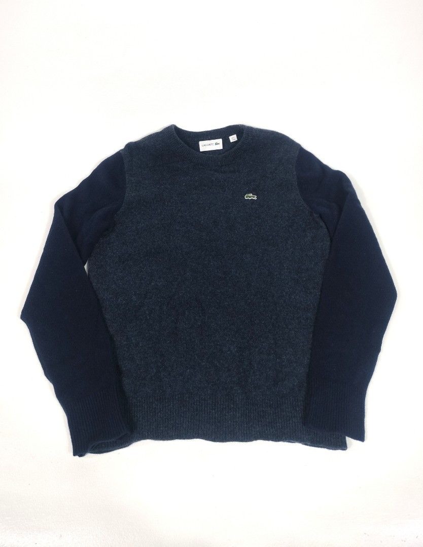 Lacoste Wool Crewneck Sweater Dark Blue Size (Category: Coats, Jackets and Outerwear) located in Manila. Submitted by callmetin (Listing ID 1465296700, Image 1). Description: Condition : Likenew Size : 4 Medium Dimension 👇 Chest : 19 Lenght : 26 Shoulder : 16 Sleeve : 25 - Type: Wool Sweater - Color: Dark blue with dark grey-blue textured torso - Size: US Medium (Tag 4) - Details: Classic crewneck, ribbed cuffs and hem, embroidered green crocodi